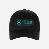 Black cap with Mercedes-Benz Petronas Formula One Team logo on a white background